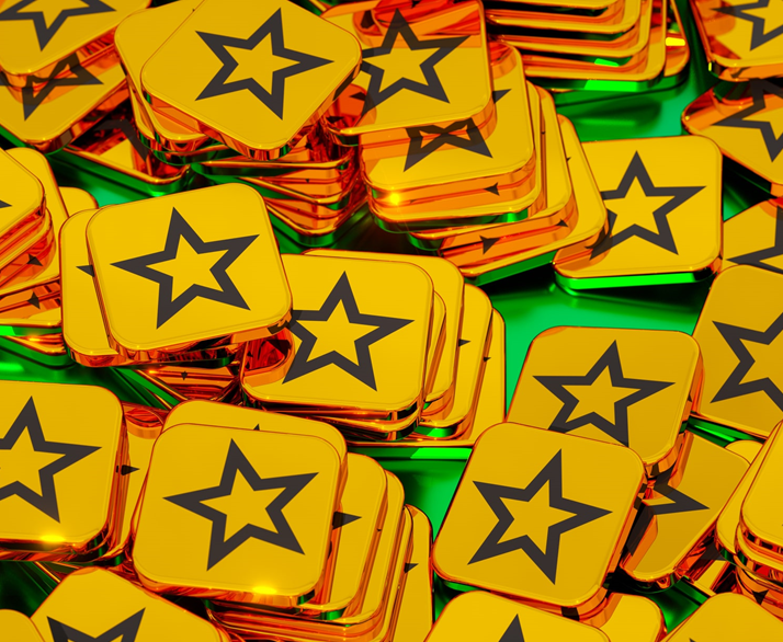 Gold tokens with star outline on the surface