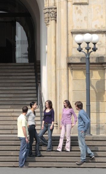Students talking on stone stairs